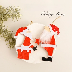 Wooden Santa Claus Christmas tree ornaments with red and white festive holiday accents