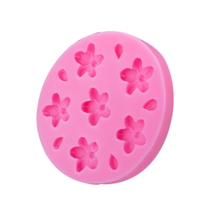 Pink silicone mold featuring cherry blossom and petal shapes for DIY cake decorating