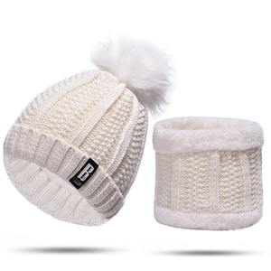 Detailed view of cream knit beanie and neck warmer set with thick plush lining