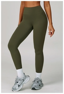 Close-up of army green high-waisted yoga leggings showing seamless shaping fabric texture