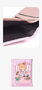 Detail view of pink trifold wallet interior and cute cartoon bear print design