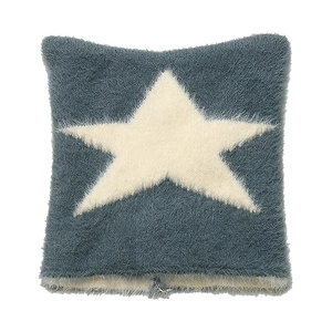 Detail of plush star pattern cushion cover in soft blue and white faux fur texture