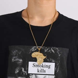 Gold-plated Africa map pendant necklace with crystal inlay worn by a model