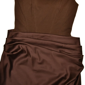 Close-up of chocolate corset dress with matte boning detail and ruched satin fabric texture