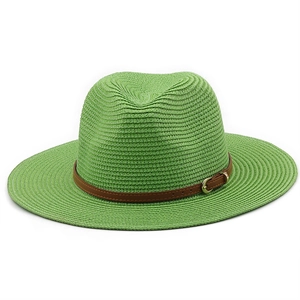 Detailed straw sun hat texture featuring lime green weave and brown leather band buckle