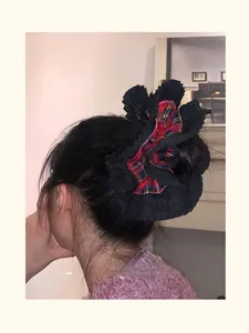 Close-up of oversized double-layer plaid hair scrunchie with pleated lace details on hair