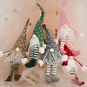 Five glowing Christmas gnomes with long legs in assorted colors for holiday tree decoration