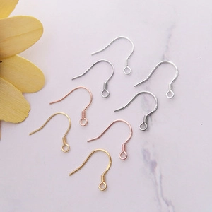 Macro detail of S925 sterling silver earring hooks in silver gold and rose gold