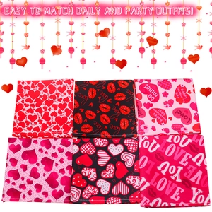 Detail showing set of six Valentine's Day dog bandanas with heart prints and slogans