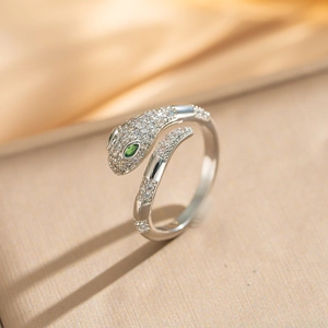 Luxurious adjustable silver snake ring with micro-set zircon and green gemstone eyes