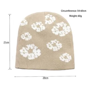 Beige knitted beanie with white floral jacquard pattern for winter windproof warmth