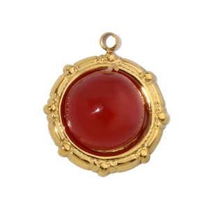 Detail of red oval natural stone pendant with vintage gold stainless steel frame