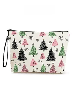Close-up of canvas makeup bag with hand-drawn Christmas tree prints and black zipper