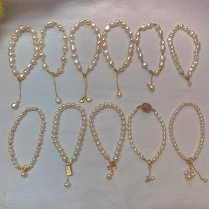 Collection of Baroque pearl bracelets with 14K gold-plated chains and handmade tags