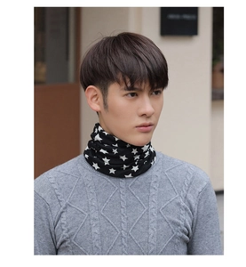 Detail of soft black knit neck warmer featuring white star pattern on a male model
