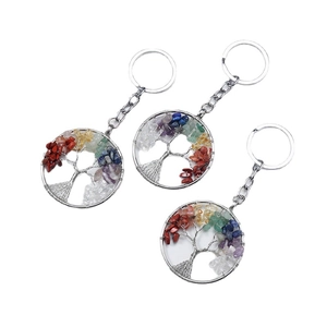 Three Tree of Life keychains with colorful natural crystal stones on silver metal wire