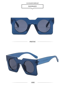 Detail view of square blue sunglasses frame with round dark lenses and temple markings