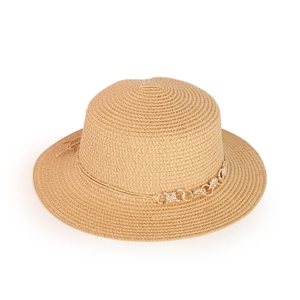 Close-up of woven straw sun hat texture featuring silver metal chain and bow detail