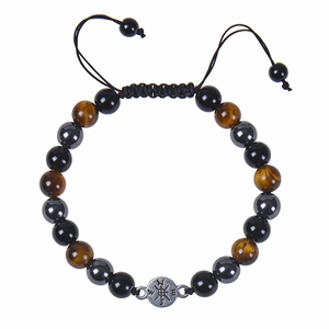 Detail of adjustable tiger eye stone bracelet with compass pendant and woven cord