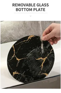 Macro view of detachable black tempered glass shelf with gold marble pattern for vanity
