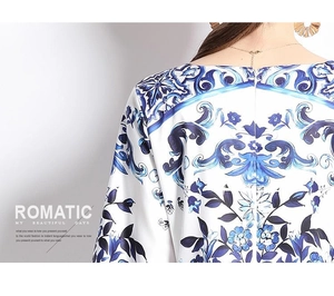Detail of invisible zipper and porcelain print on women's flared sleeve dress