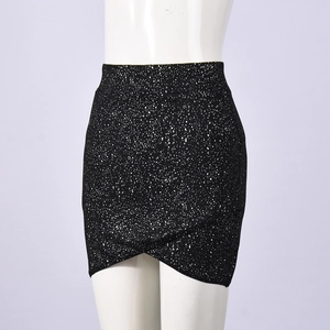 Detailed view of black polka dot mini skirt with tulip hem and elastic knit fabric