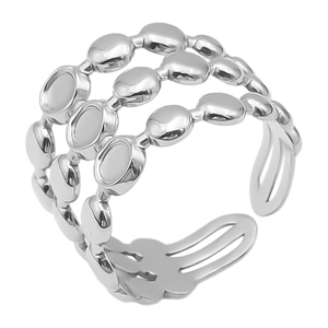 Macro shot of polished triple-layered silver stainless steel adjustable ring with oval details