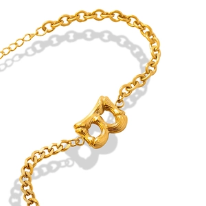 Golden hip-hop cuban chain bracelet featuring a textured bamboo-style letter B pendant
