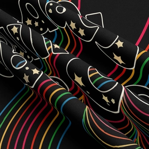 Close-up of bohemian tapestry fabric showing ghost patterns and rainbow wave details