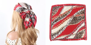 Red satin square scarf with leopard print and golden chain pattern shown on model and flat