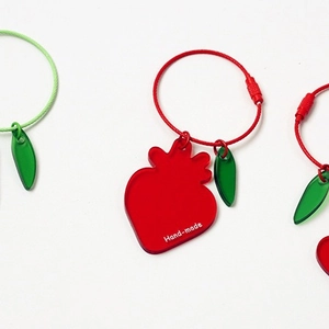 Hand-made strawberry acrylic keychains for Airpods with red straps and green leaves