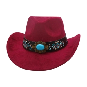 Close-up of wine red western cowboy hat with blue floral embroidery and turquoise stone