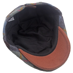 Detail view of the retro plaid newsboy cap interior lining and premium felt brim finish