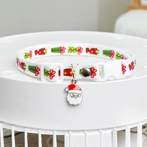 Christmas dog collar with red green gift prints and Santa Claus pendant on white base