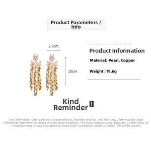 Detail of 10cm tassel earrings with pearls and dimensions of 2.5cm by 10cm on white