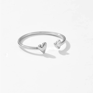 Polished S925 silver open ring featuring minimalist 3D heart charms on white background
