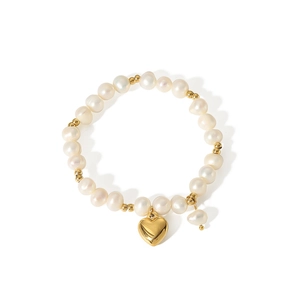 French freshwater pearl bracelet with gold heart pendant in polished titanium steel