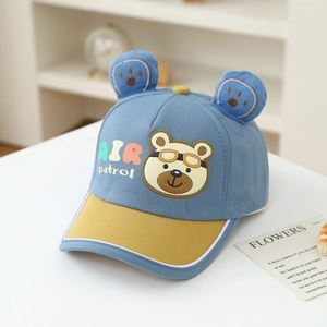 Detail of blue and yellow child baseball cap with bear ears and air patrol patch