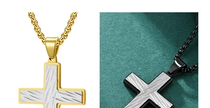 Detail of cross pendants in gold and black finishes with textured metal surfaces