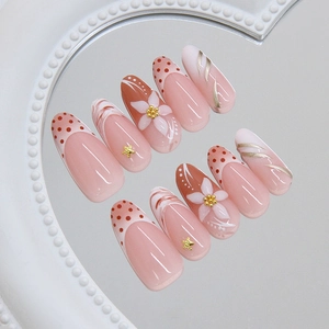 Elegant long oval press-on nails with 3D gold stars and hand-painted floral art