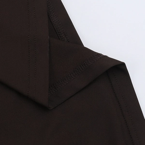 Macro shot of precise double-needle stitching and hem on dark brown mesh dress fabric