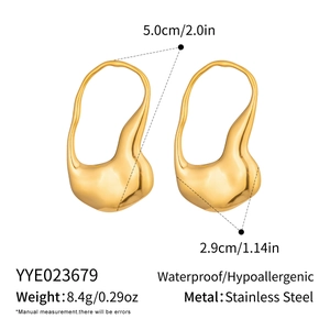 Detail view of irregular geometric earrings in gold finish with precise measurements