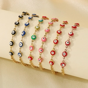 Detailed display of six 18K gold plated evil eye anklets in various vibrant colors
