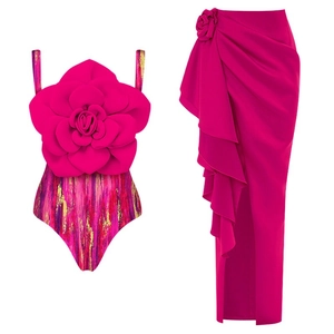 Chic two-piece magenta swimwear set with a 3D floral top and a high-slit wrap skirt