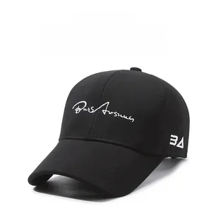 Close-up of white letter embroidery and premium twill texture on a black baseball cap