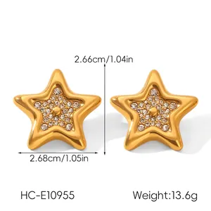 Detailed view of gold star earrings with sparkling rhinestones and exact size dimensions