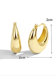 Detail of 2cm gold-plated brass hoop earrings with S925 hallmark and polished finish