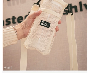 Detail of off-white mesh water bottle carrier bag with TIME STROLL logo and strap