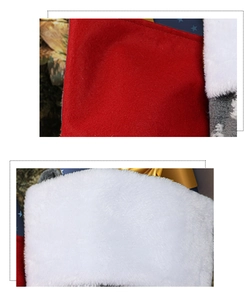Macro detail of red felt and white faux fur texture on a plush Christmas stocking