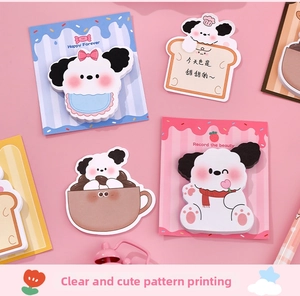 Close-up of cute cartoon puppy sticky notes in various shapes like toast and coffee cups